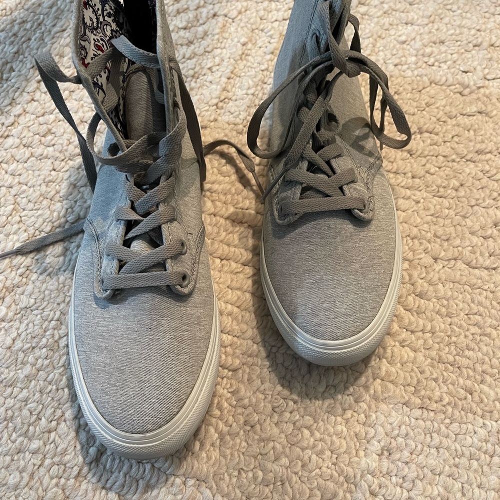 Women’s 8.5 new Vans.  Grey with back zipper and front tie.  Never worn